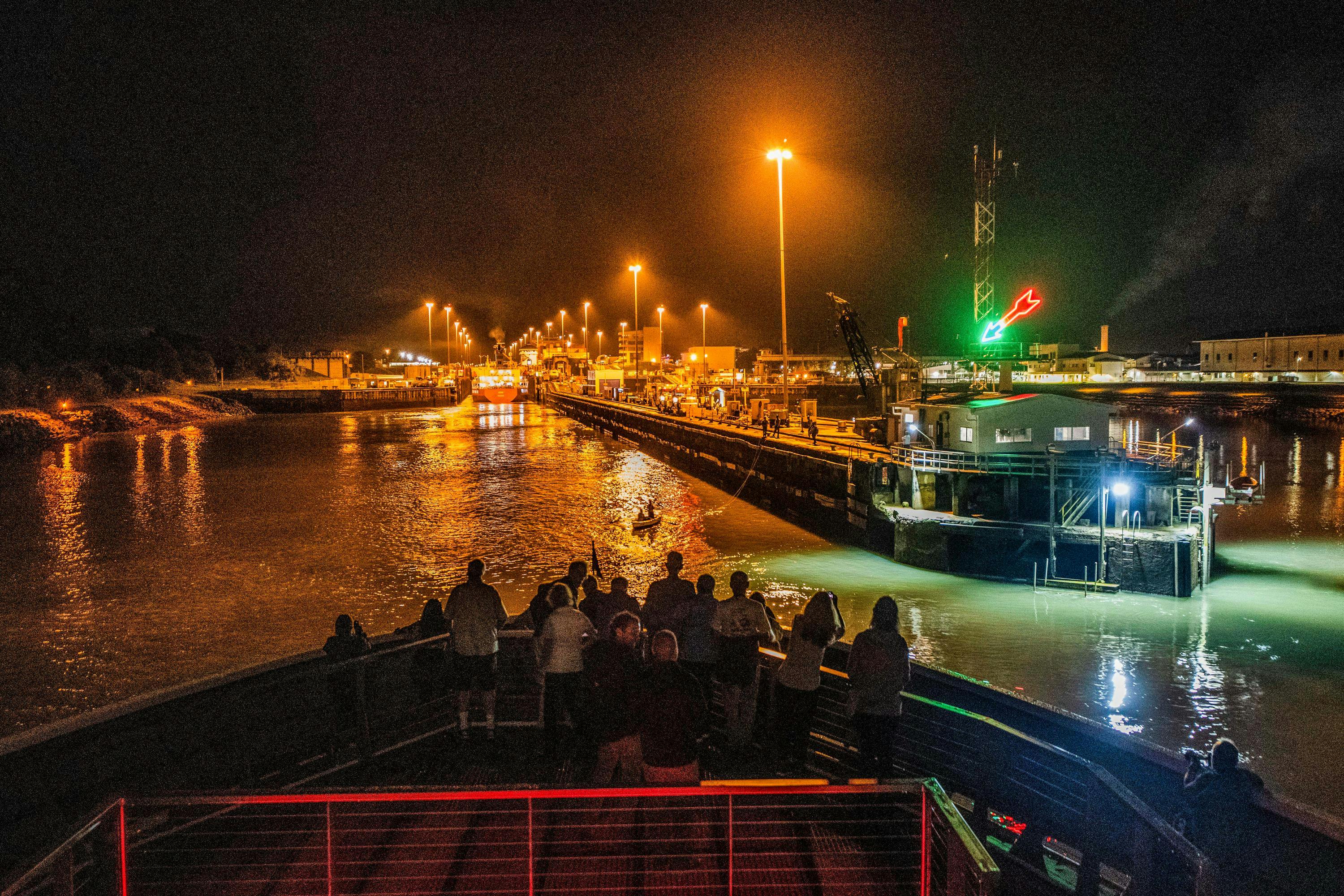 National Geographic Quest transiting the Panama Canal at night.