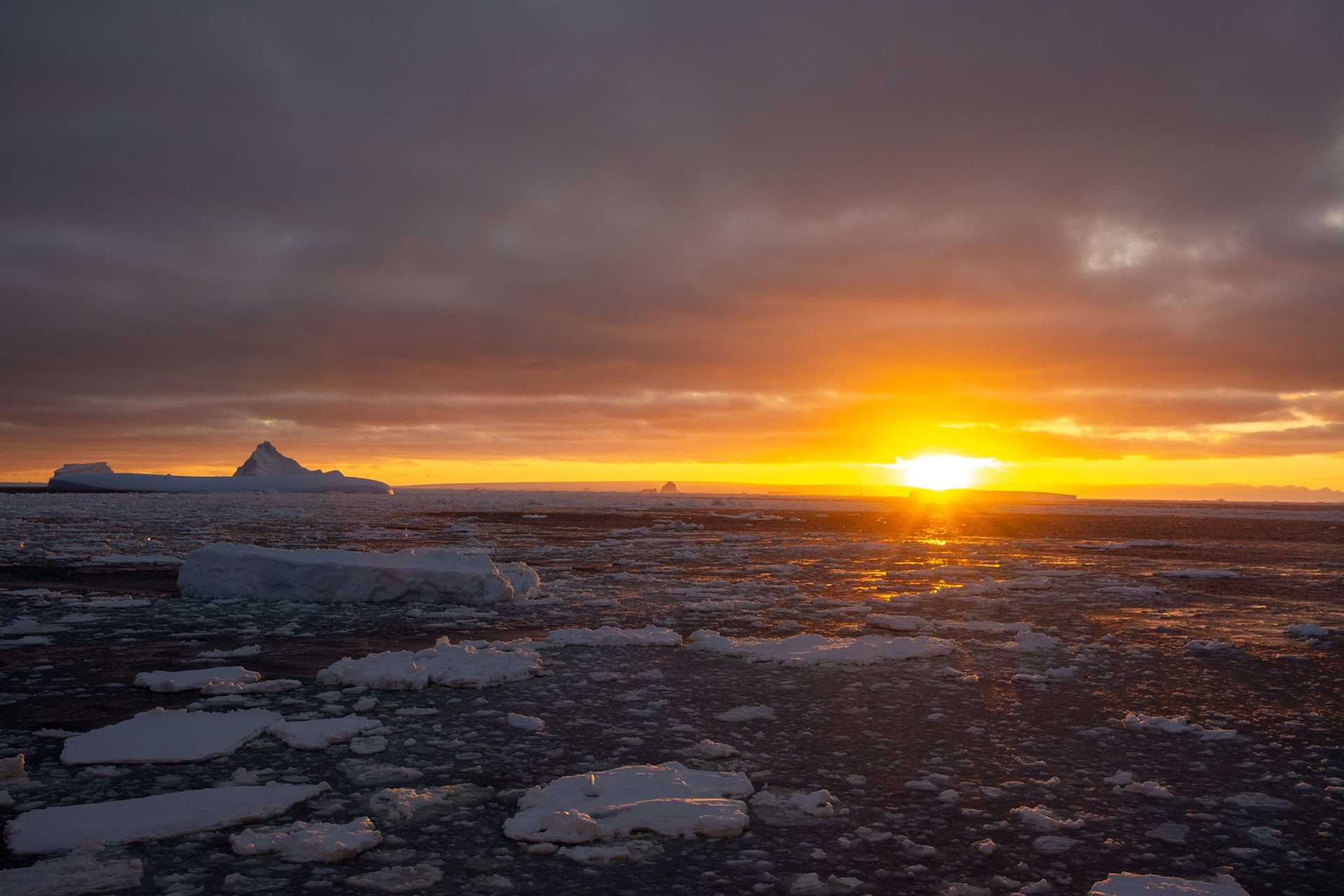 sunrise over antarctic ice