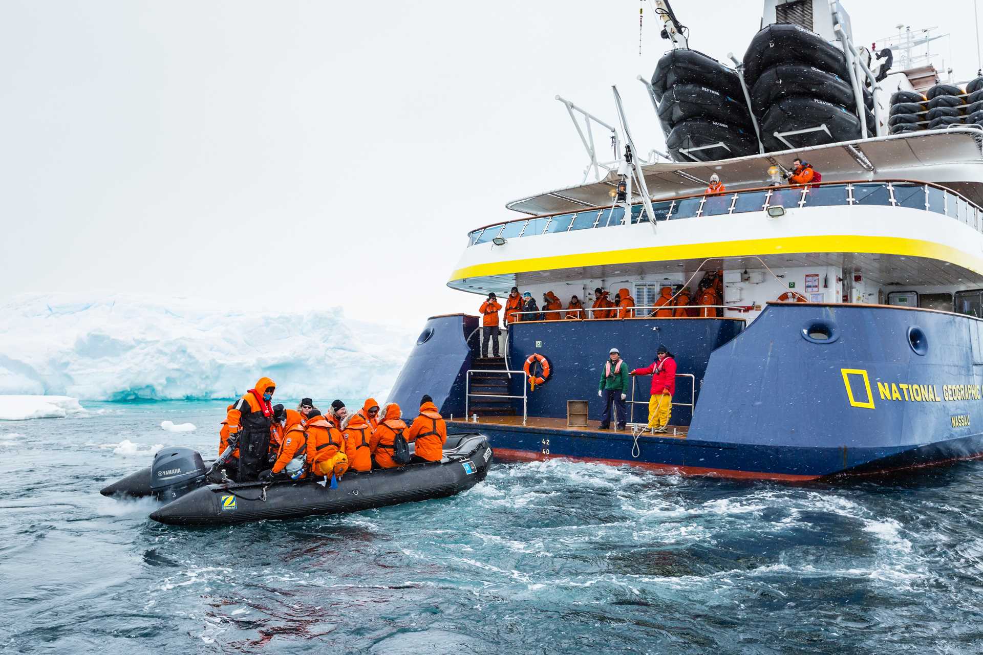 Guests arrive by Zodiac to the National Geographic Orion.