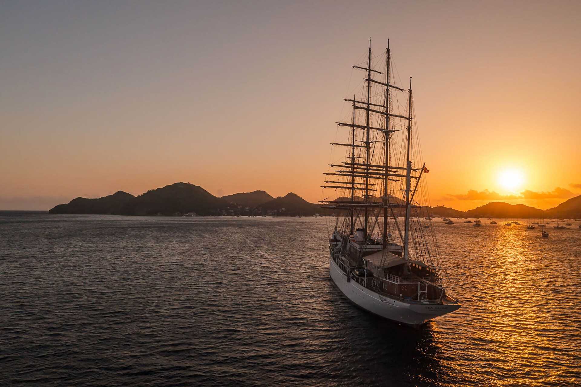 Sea cloud ship in harbor at sunrise