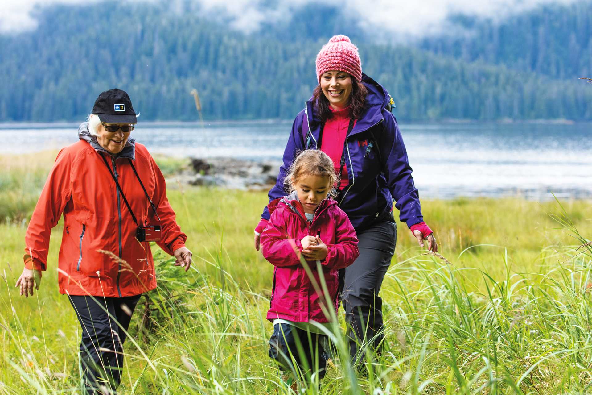 A multi-generational family hikes in Alaska.