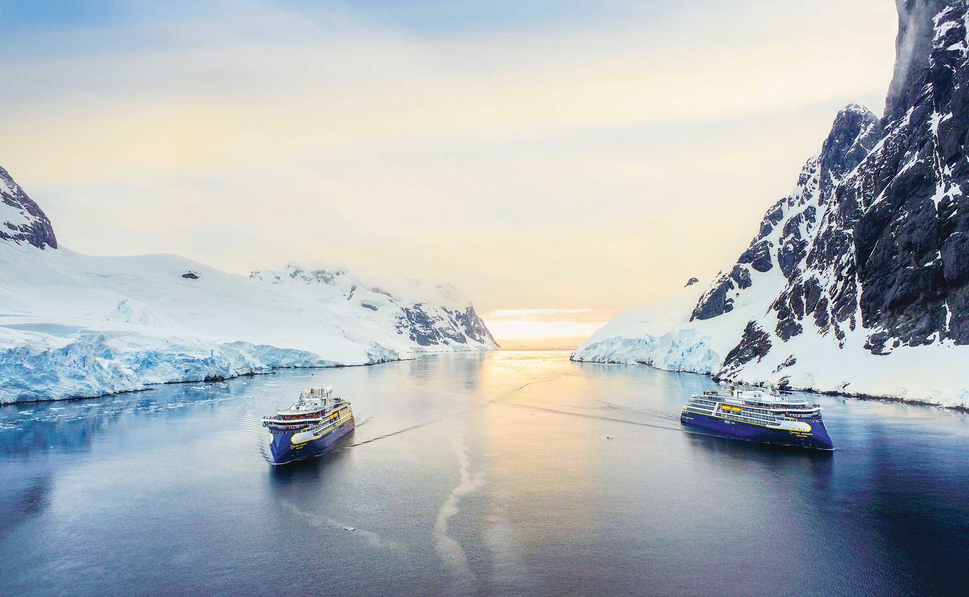 Aerial view of the National Geographic Resolution and the National Geographic Endurance sailing in Antarctica.