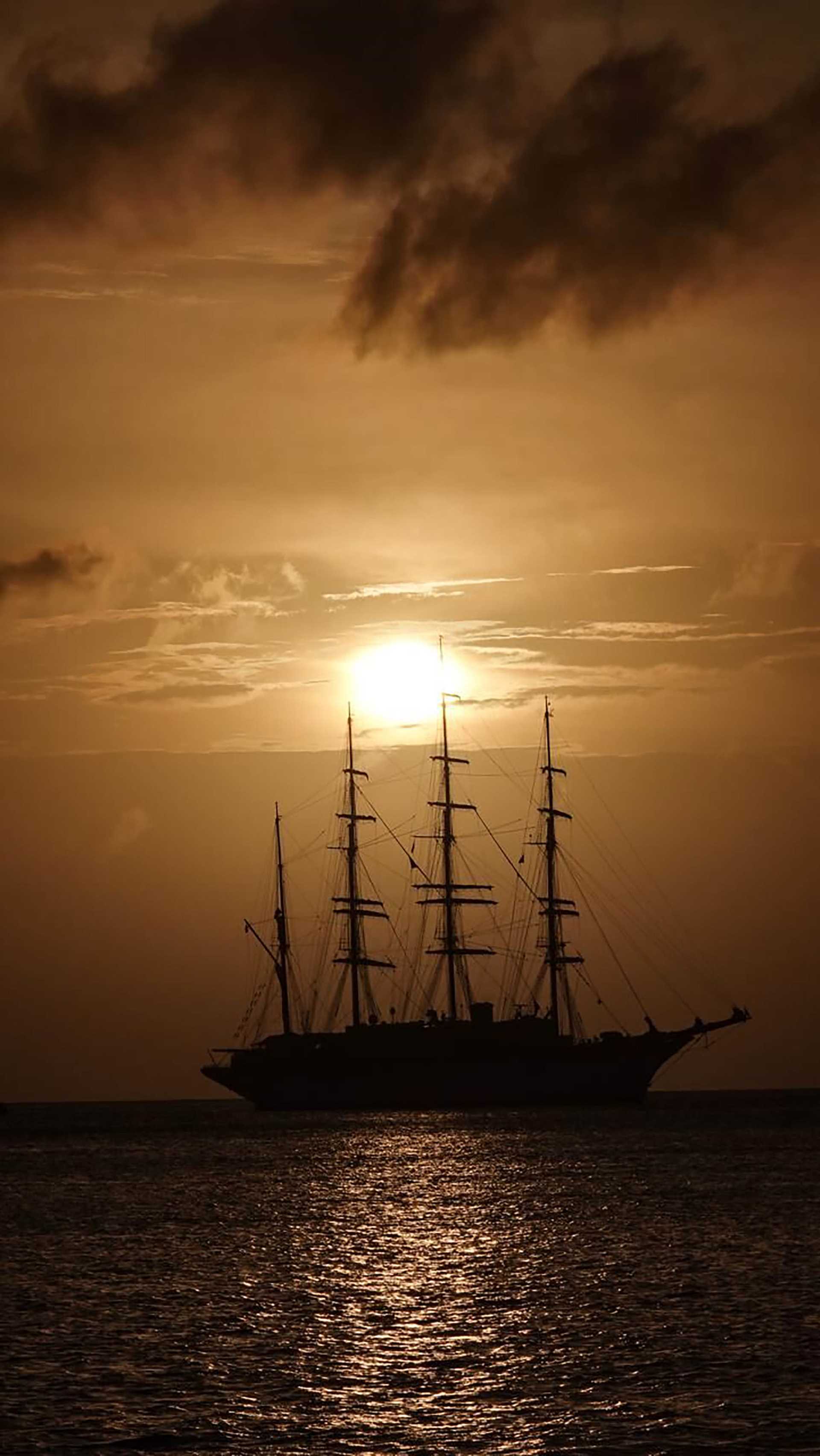 sea cloud ship at sunset