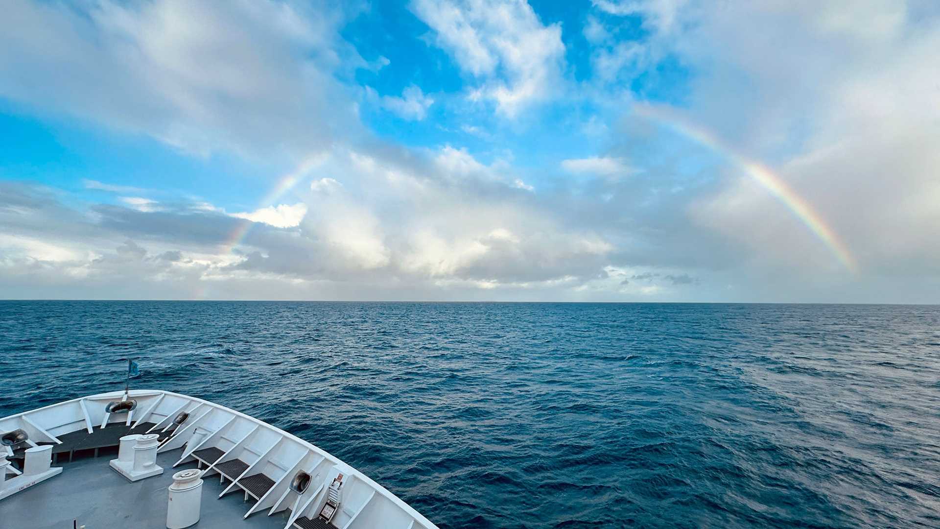 rainbow over the bow of national geographic orion